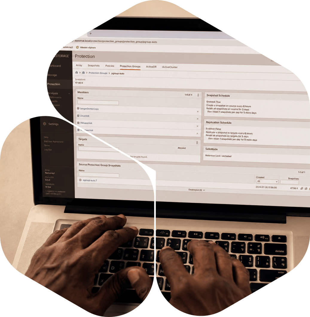 Close-up of hands typing on a laptop with a software interface displayed