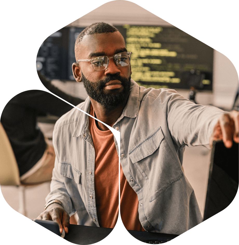 Focused individual engaged in programming or coding