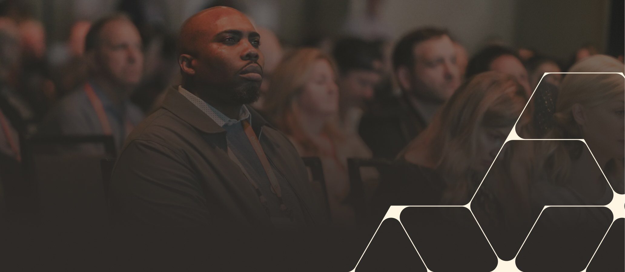 Audience members engaged during a conference presentation