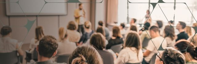 Audience engaged in a presentation at a seminar or conference
