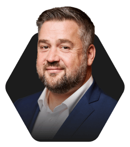 Professional Headshot with a Warm Smile featured in a hexagonal frame on a dark background