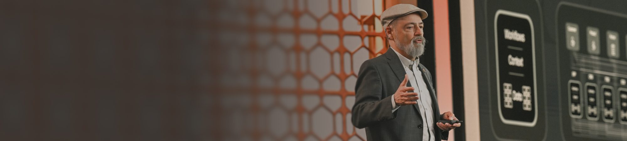 Pure//Accelerate 2026 logo against a walnut brown background with orange hexagonal grid patterns