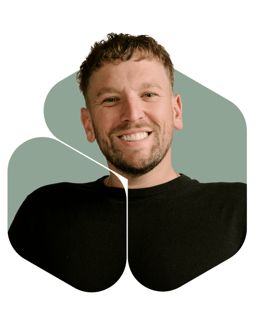 Cheerful Individual in Front of a Subtle Green Backdrop