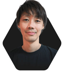 Professional Headshot with a Warm Smile featured in a hexagonal frame on a dark background