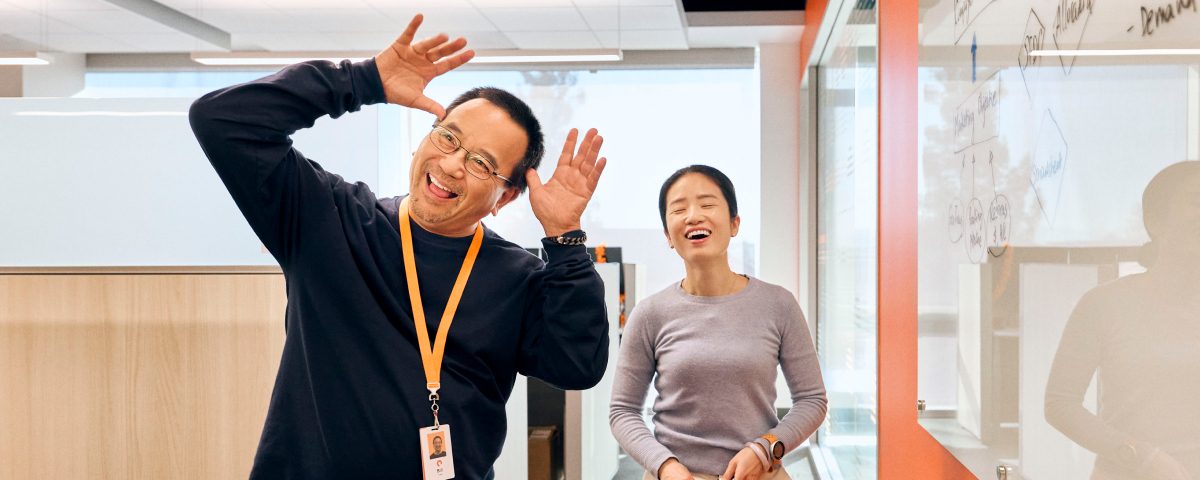 Two colleagues having fun in an office environment
