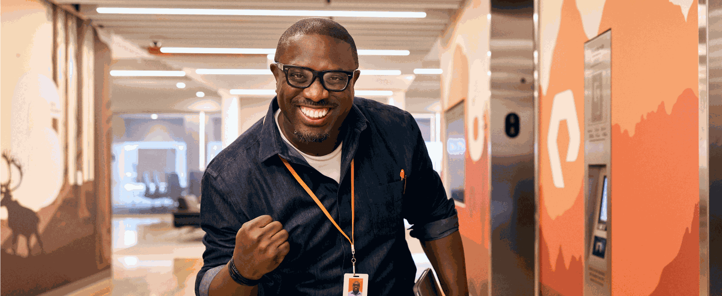 Excited man celebrating success in an office environment