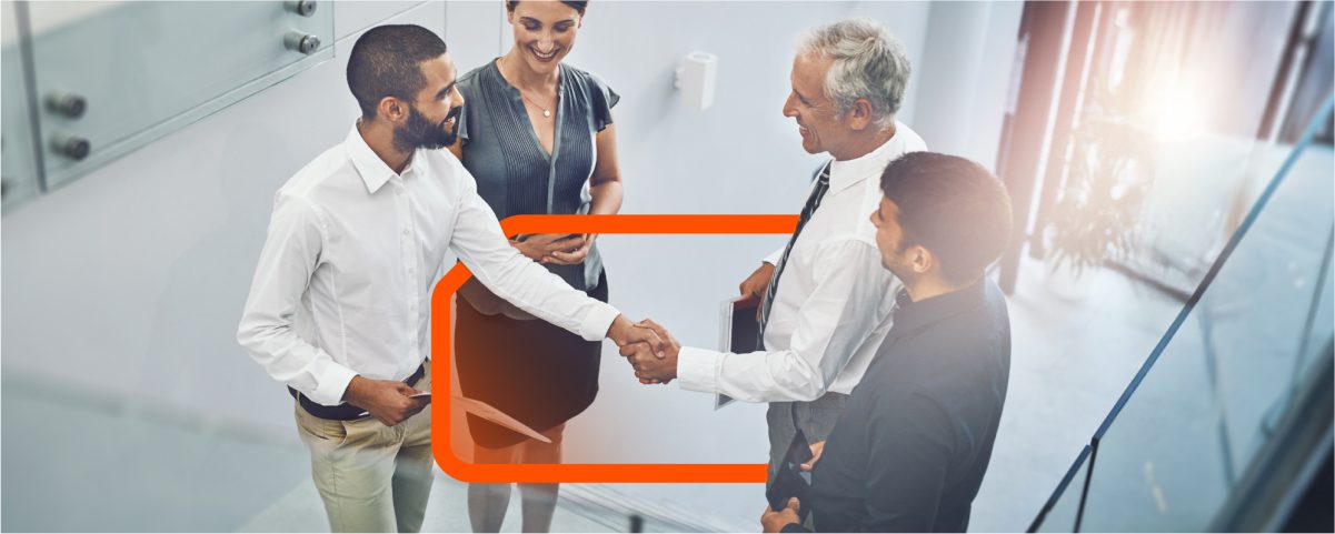 Business Professionals Shaking Hands in an Office Setting