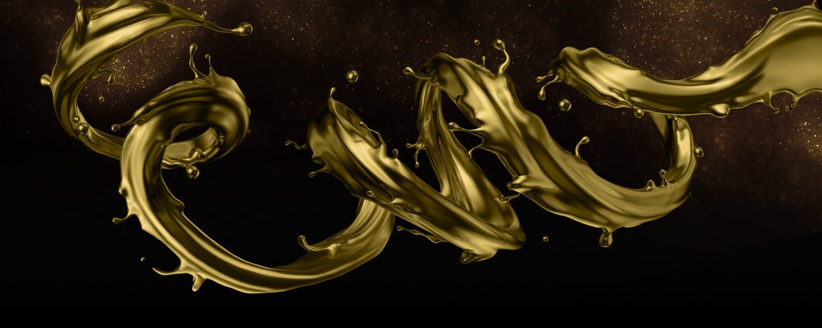 A spiral of gold liquid expanding over a background of gold particles